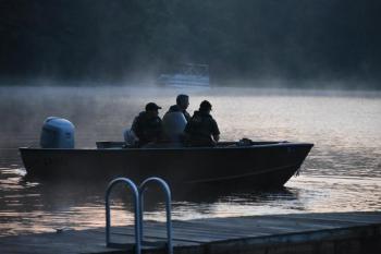 Maine Wardens leave the dock as the sun rises. (Photo by Sarah Thompson)