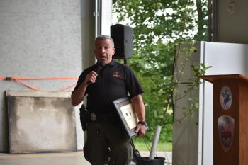 Scott Maddox represents the Forest Service and conveys thanks to Keller in his role as Town forest fire warden. (Photo by Sarah Thompson)