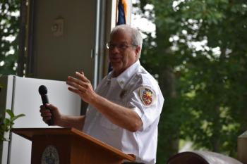 New Hope Fire Chief Mike Easton chokes up as he announces the Clarence Keller Scholarship Fund. (Photo by Sarah Thompson)