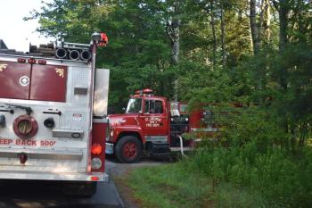 A St. George tanker truck idles in the driveway of 47 Turkey Cove Road, in St. George, in response to an early morning fire call at that location. (Photo by Sarah Thompson) 