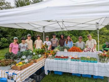 The Erickson Fields farm crew (l-r): Erickson Fields Farm Manager Carrie O'Brien, Huy Nguyen, Oliver Wight, Julian Mora, Natalie Clark, Poet Rancourt, Sana Doshi Paige Mosher, Liliana Krupinski, Elena Payne. (Photo courtesy Aaron Englander)