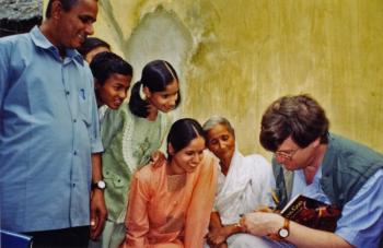 Stephen Huyler signs a book in Orissa in 1999. (Photo courtesy Camden Conference)