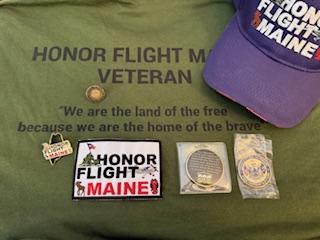 The hat and shirt Danny got, along with the pins and patches he received while on his trip. (Photo courtesy Danny Swindler/Dawn Bailey)