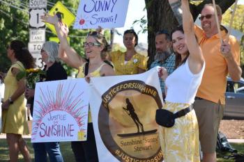 Friends and family of Sunshine Stewart get support from motorists following the first real proceeding of Stewart's July  2, 2025 homicide. (Photo by Sarah Thompson)