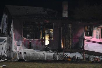 Flames that were initially only visible at two rear walls of 27 Westbrook Street quickly spread through the rest of the house, Saturday, Aug. 23, 2025. (Photo by Sarah Thompson)