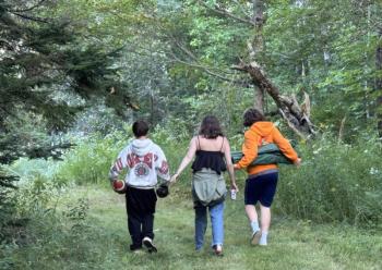 Three children walk to the shore in the final weekend before they are off to Camden Hills Regional High School. (Photo by Tracee O’Brien) Kids