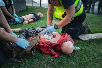 Applying bandages to a chest wound. (Photo courtesy Connor Howland/Camden Fire Dept.)