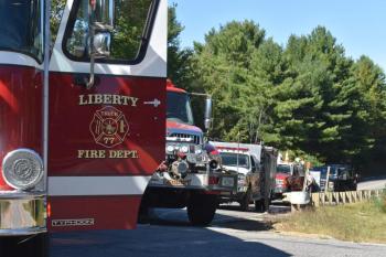 Several fire trucks line Route 220 in Liberty. (Photo by Sarah Thompson)