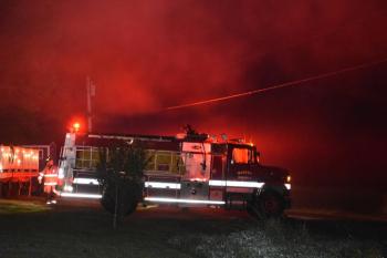 White smoke around the truck's red lights creates a red glow around the vehicle. (Photo by Sarah Thompson)