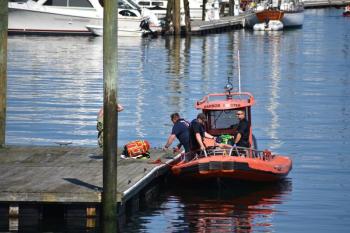 Rockland EMS waits for a stretcher after transporting a patient off the Breakwater, Sept. 16. in the early afternoon. (Photo by Sarah Thompson)