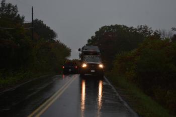 Tow truck with vehicle on back
