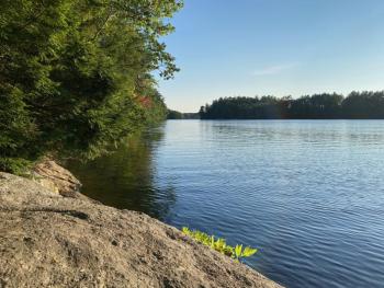 View of a river as seen from a boulder shoreline