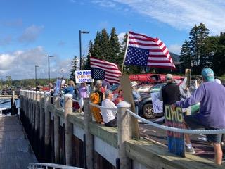 Demonstrators line the Port Clyde Public Landing to protest rulings by U.S. Supreme Court Chief Justice Roberts. (Photo courtesy Nancy Button) Demonstrators line the Port Clyde Public Landing. (Photo courtesy Nancy Button)