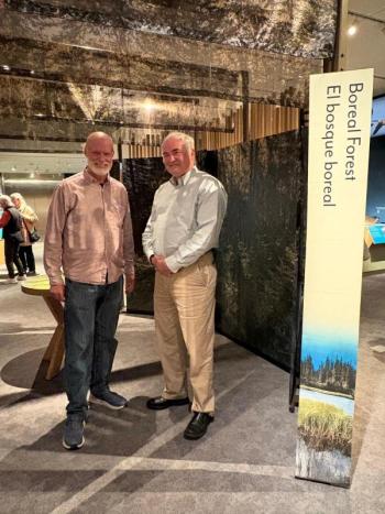 Jeff Wells (right), one of the authors of this column, standing near the traveling Smithsonian boreal exhibit at the Peabody-Essex Museum in Salem, MA. Wells was instrumental in the development of the exhibit. (Courtesy photo)