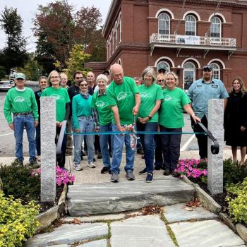 Members of the Belfast Garden Club and Public Works watch as a ribbon is cut in dedication to the new garden. (Photo by Charlotte Holmes)