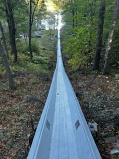 (Photo courtesy Peter Berke) Abe Rhode, Kristi Van Blarcom, Ian Bogey, David Garner paint the toboggan chute with a fresh coat of white paint Oct. 5. (Photo courtesy Peter Berke)