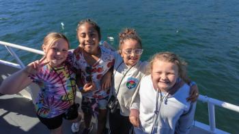 Four girls at railing