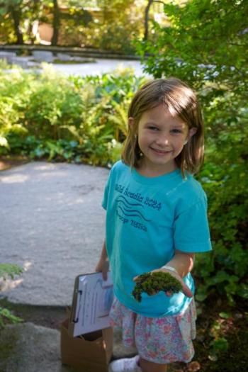 Girl holding moss