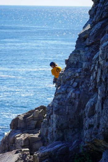 Girl on cliffside