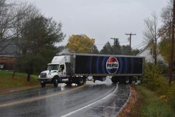 freightliner backing into parking lot to turn around