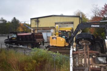 Construction vehicles working the scene