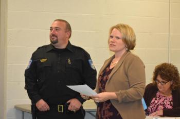 Town Manager Kara George (c) introduces Thomaston's new police chief, Eric Quatrano, at the official swearing-in ceremony at the start of a Select Board meeting, Oct. 15, 2025. (Photo by Sarah Thompson)