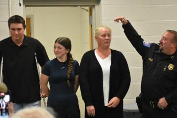Eric Quatrano introduces his wife and children. (Photo by Sarah Thompson)