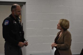 Patrol Officer Chris Hansen converses with Town Manager Kara George.  (Photo by Sarah Thompson)
