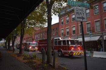 Three fire trucks facing the wrong way on Main Street