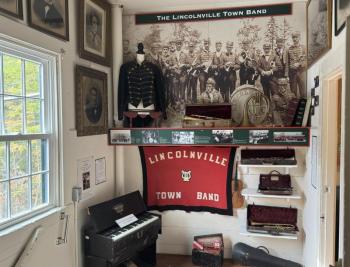 An exhibit for the Lincolnville Town Band at the top of the stairs. (Photo by Ed O’Brien) LHS