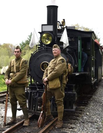 World War I reenactors in front of a train