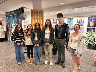 (Photo courtesy Julie Fajardo) Six attendees pose for a picture in a lobby