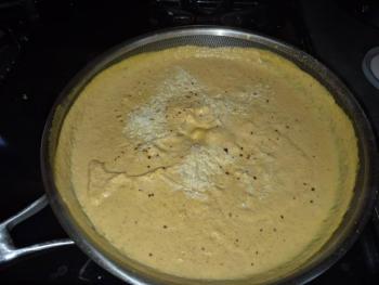 Generously sprinkle Parmesan cheese into the cream sauce, along with a pinch of red pepper flakes. Photo by Kay Stephens
