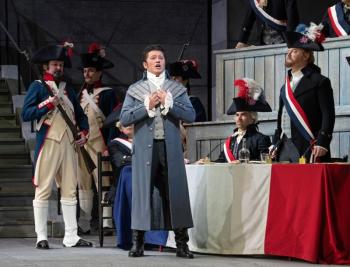 Male sings while soldiers stand in background
