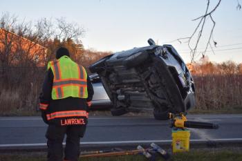 Chain attached to vehicle undercarriage pulls vehicle to the ground