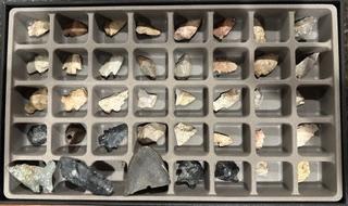 Small compartments of a box filled with items