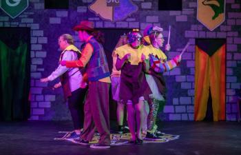 Four people act out a scene