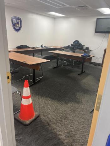 safety cone marks a water-soaked carpet