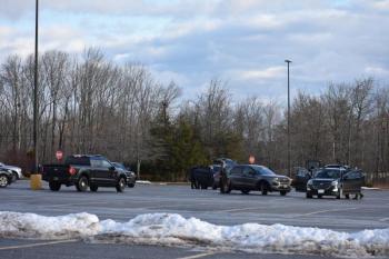 Law enforcement vehicles in a parking lot