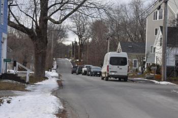 vehicles parked along a residential street