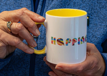 mug with "happiness" written on the side.