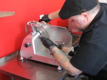 Williams at the slicer. Photo by Kay Stephens