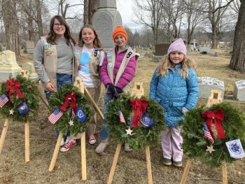 Four females in a cemetery