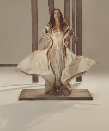 Female standing, skirt like wings