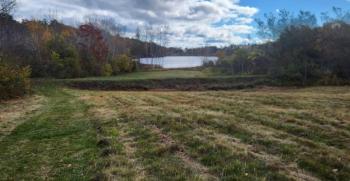 A photo of the section of the old railbed/road that was included in an application to the Maine Department of Environmental Protection seeking approval for its removal (Photo courtesy Maine DEP)