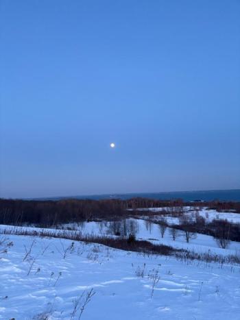 Snowy view and full moon
