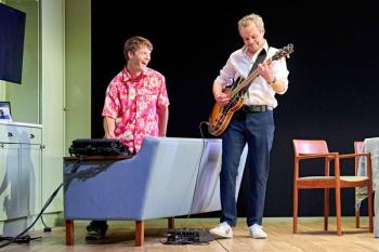 Two males play music