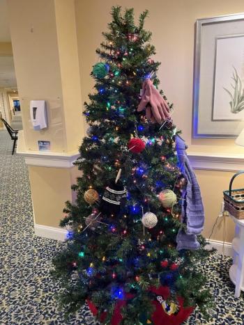 Decorated tree with mittens and gloves and decorations