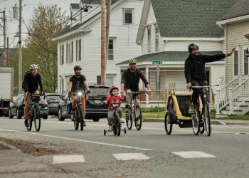 Four men, one child bike down south Main Street in Rockland