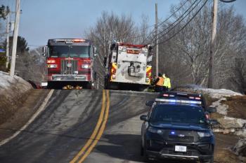 full road closure with police cruiser, two fire trucks